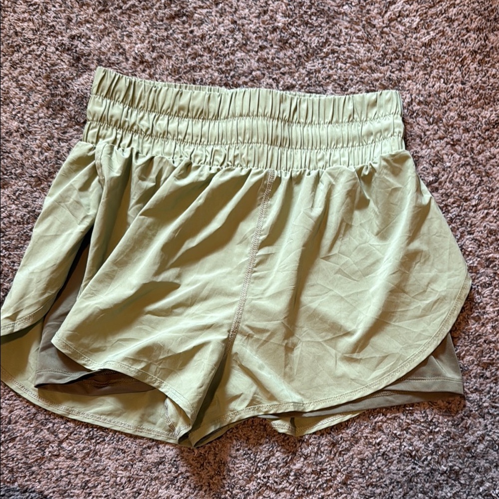 Green Athletic Shorts with Lightweight Fabric and Curved Hem